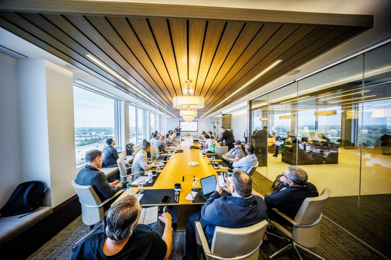 An Industrial IQ bootcamp group around a boardroom table