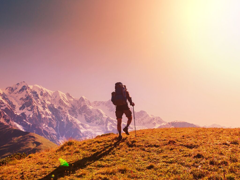 a man climbing a mountain: mountain a dventures